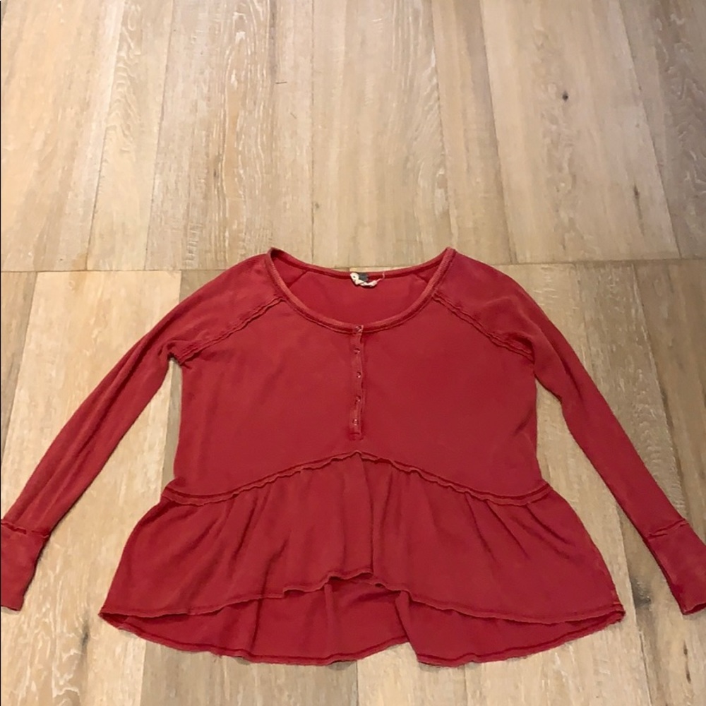 Long sleeved, red button-up top